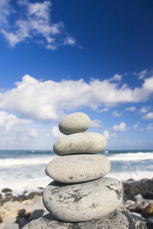 Stack of zen pebbles by the seaの写真素材