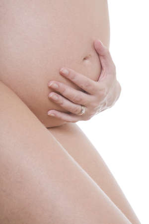 Pregnant woman in bedの写真素材