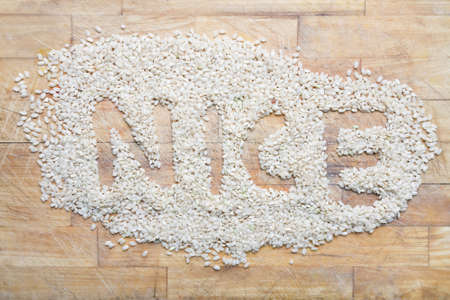 Pile of rice with the word nice written in itの写真素材