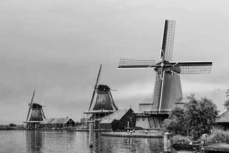 Zaanse Schans is a small village on the banks of the Zaan river, complete with tidy green houses and real working windmills の写真素材
