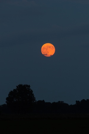 A beautiful red moon on Northern Italyの写真素材