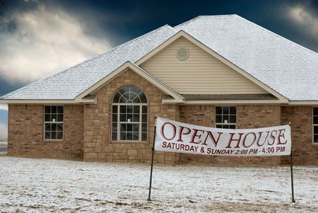Newly constructed house for sale.Light snow on roof and groundの写真素材