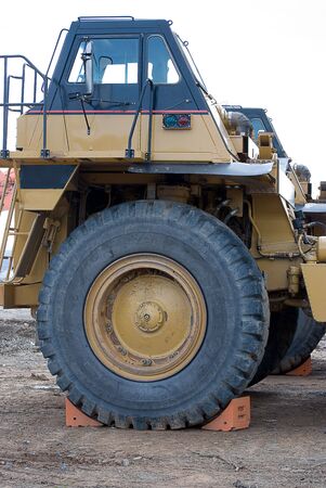Cab and large front tire of huge dump truckの写真素材