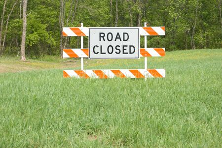 Road closed sign in middle of fieldの写真素材