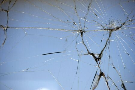Cracked windshield on blue backgroundの写真素材