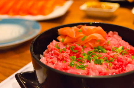 Toro Donburi in the black bowl. (little depression angle)の写真素材