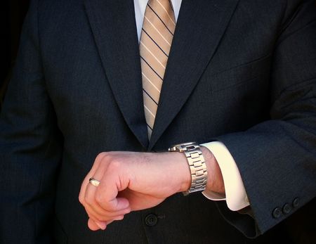 business man checking the time