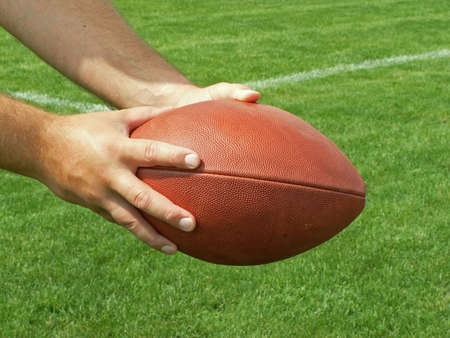 handing off the footballの写真素材