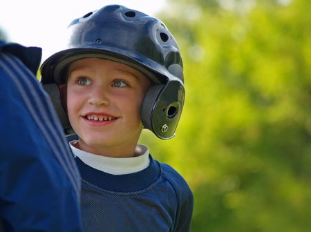 baseball boy interacting with base coach