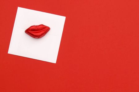 Valentines Day - red lip chocolate on envelopeの写真素材