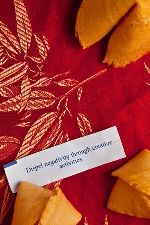 Fortune cookies on red silk: dispel negativity through creativityの写真素材