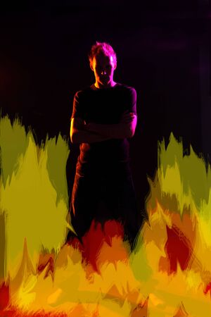 mysterious looking man with flames around him