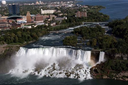 Niagara Falls with city behind; a popular tourist destinationの写真素材