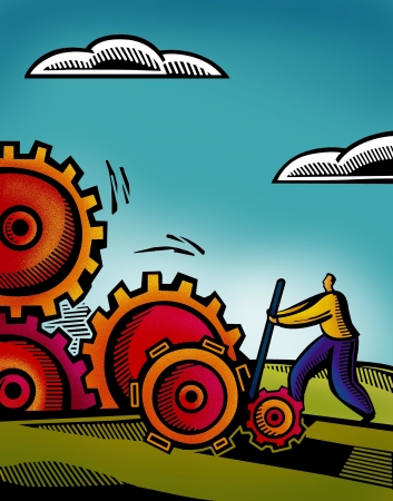 A business man working on inter connected gearsの写真素材