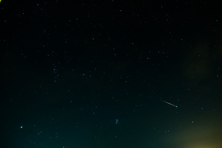 One beautiful perseid meteor crossing the sky. Here is visible also some of constellations.の写真素材