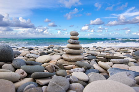 Zen pyramid on the pebble beachの写真素材