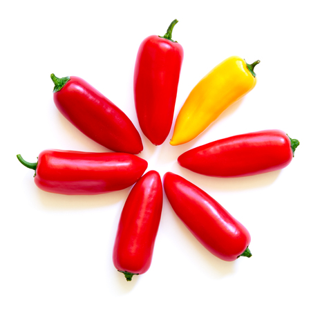 Red and yellow peppers isolated on white