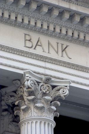 Neoclassical architechture sports a column with the word "BANK" above it.の写真素材