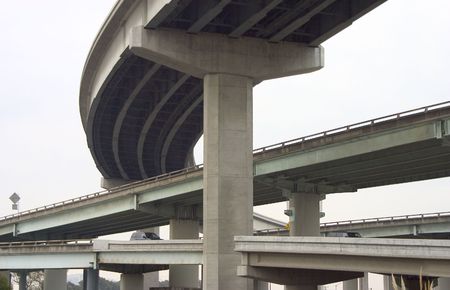 Looking like cement spaghetti, cars are routed through a complex of freeway overpasses.