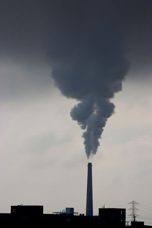 A smokestack belches pollution from a power plant.の写真素材