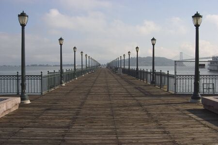 A pier extends into San Francisco's waterfront.の写真素材