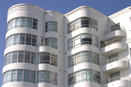 A large art deco apartment building displays it's face of curved windows and balcony's.の写真素材