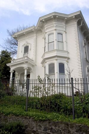 A old house looks a bit creepy up on a hill.の写真素材