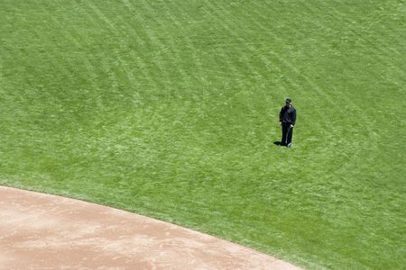 A baseball umpire, ready to make a call on a play.の素材 [FY310341728]