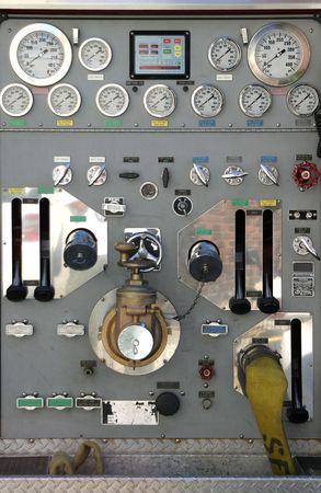 The various dials, knobs, and switches of a modern fire truck.