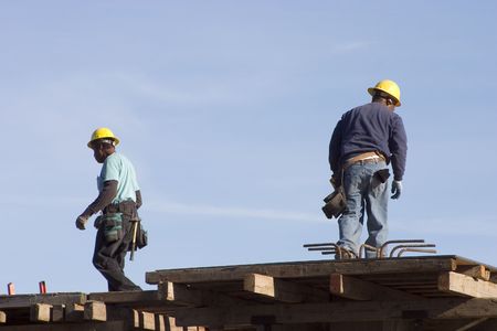 A couple works at a construction site.