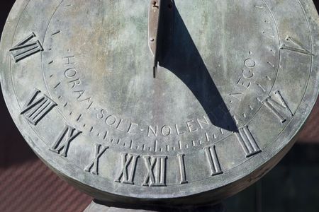 A sundial shadowing the time.の写真素材
