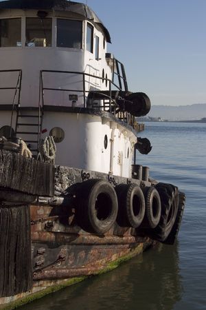 A tugboat chugs along in San Francisco bay.の写真素材