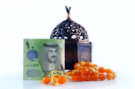Bahrain currency with Rosary - isolated 