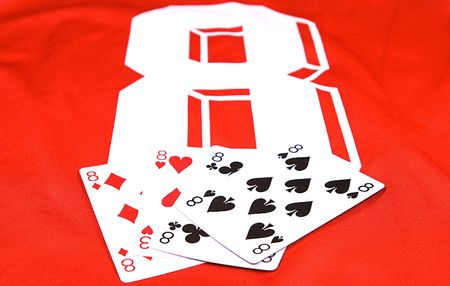 photo of number eight sport uniform and playing cardsの写真素材