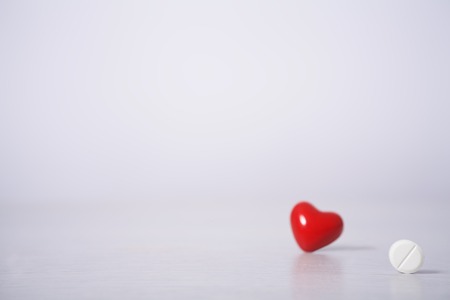 pills and red heart