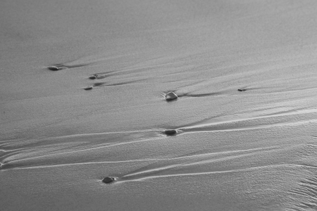 sand stones on sea waves movie blurの写真素材