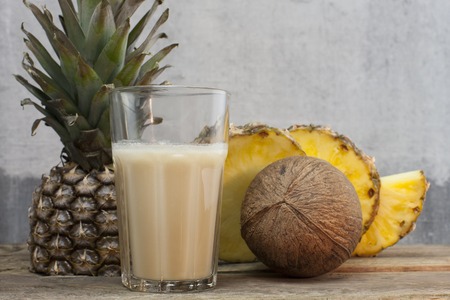 pineapple Juice glass on vintage wooden background