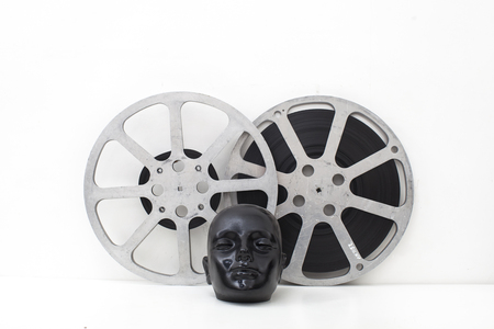 film reels of old movies and black dummy headの写真素材