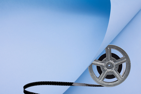 Movie film reel on blue papperの写真素材