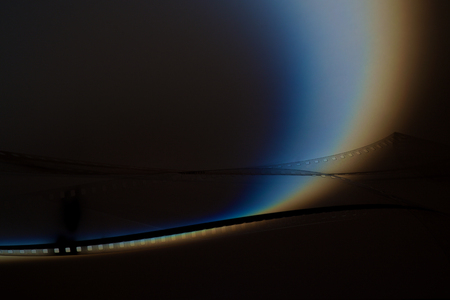 Old film strip on dark backgroundの写真素材