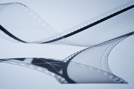 Old film strip with shadow on blueの写真素材