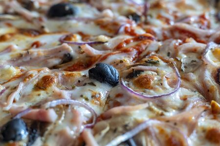 Appetizing background pepperoni pizza closeup filling the frame.の写真素材