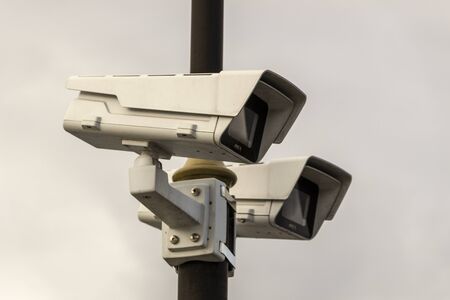 CCTV security camera on pole watching the area