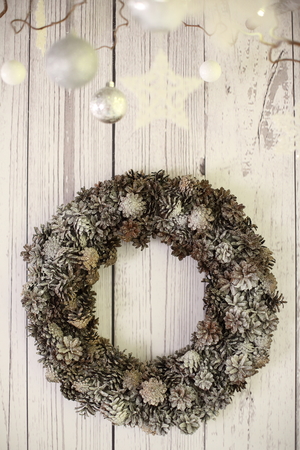 New Year decorations, a Christmas tree, garlands and balls home cosiness with a fireplace and candlesの写真素材