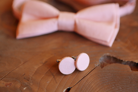 Close-up of a bow tie lying on a table, dressing the groom. Morning before the wedding or a formal...