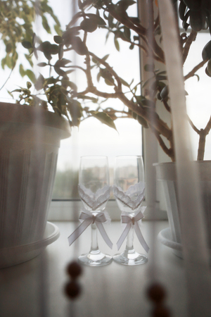Glasses of champagne on the table, a festive table with champagne, a wedding birthday.の写真素材