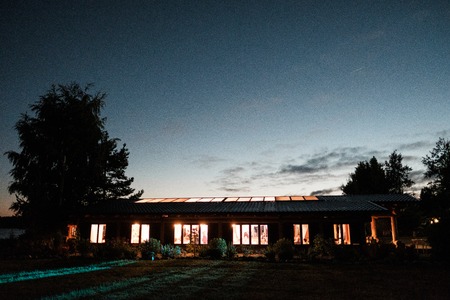 Country house, veranda or restaurant, evening view, sunset sky. Concept of a country house or wedding party.の写真素材