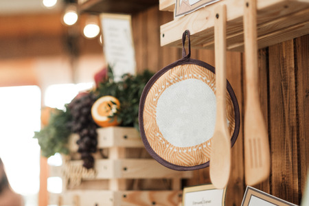 Cooking theme decor. Wooden wall, with shelves, bread and kitchen appliances. Country style.の写真素材