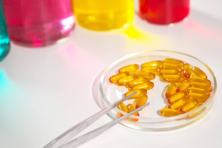 Various medical pills are on a white background. Vitamins, hemeopathy and bioactive additive against drugs.の写真素材