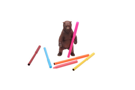 Toy bear and colored pencils. Isolated on white.の写真素材